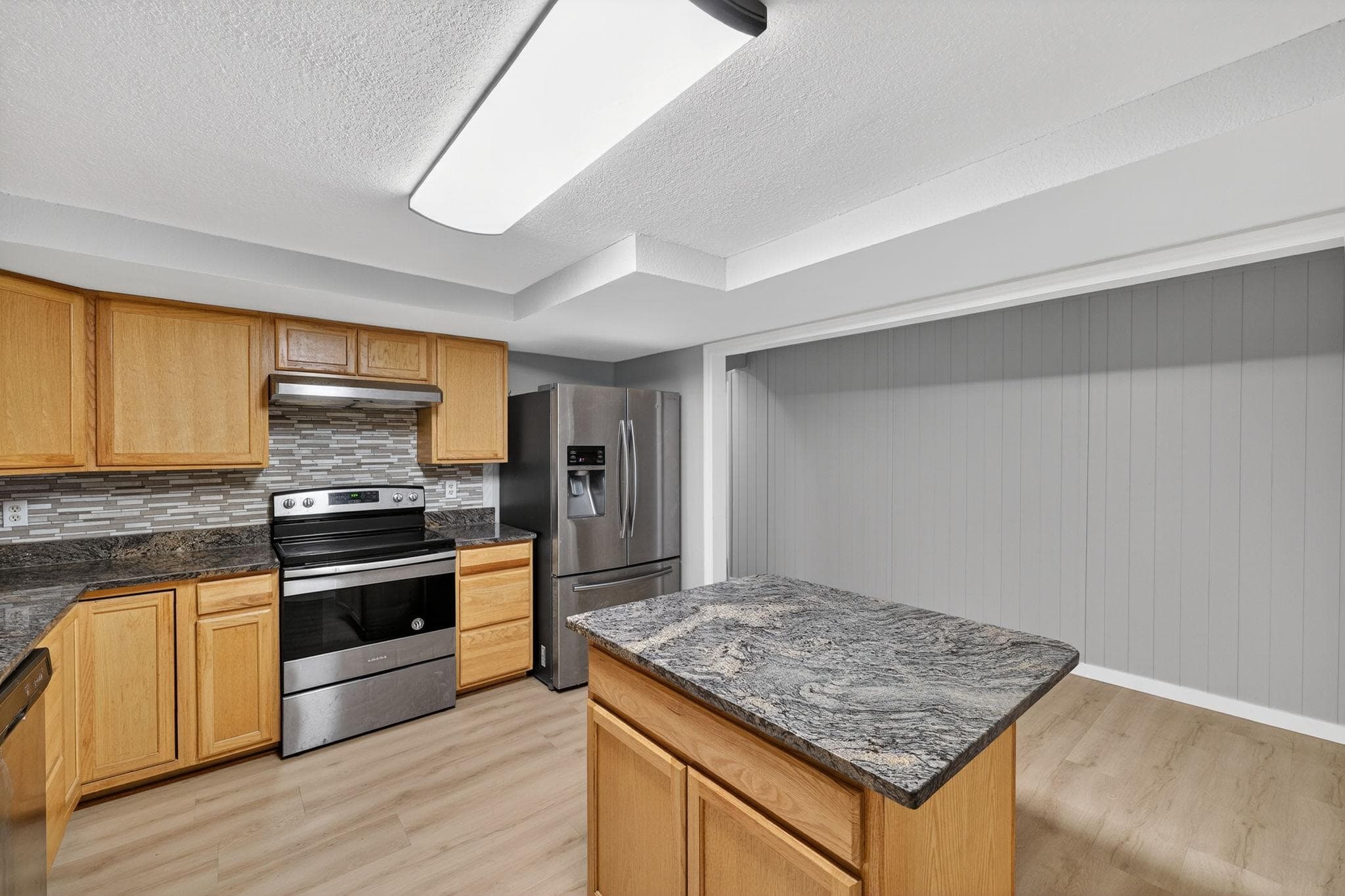 Welcome to your future culinary haven! This spacious kitchen features modern appliances, sleek countertops, and ample cabinet space, perfect for all your cooking needs. Enjoy the open layout that seamlessly connects to the living area, providing a wonderful flow for entertaining guests or enjoying a cozy night in.